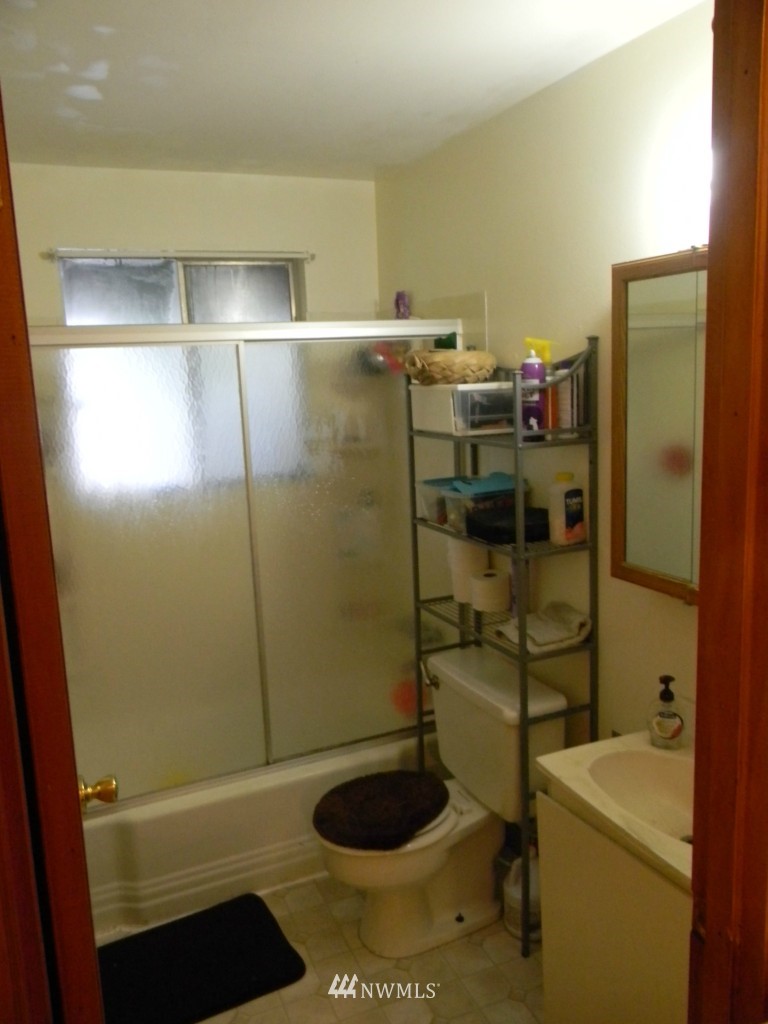 515 Roe Street Steilacoom, WA 98388 - Photo 8 of 9 a bathroom with a toilet and a shower