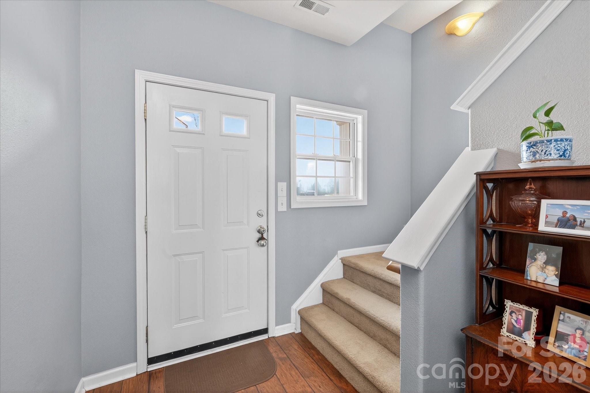 3066 Priory Ridge Drive, Unit 337 Fort Mill, SC 29707 - Photo 13 of 31 a view of staircase with white walls and a window