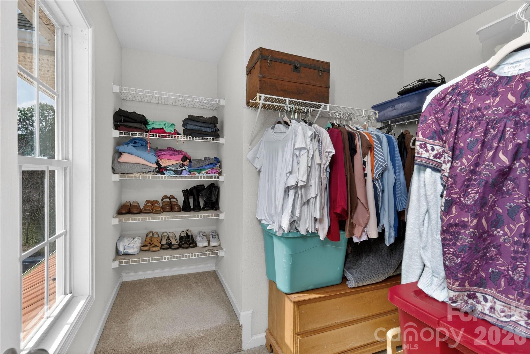 3066 Priory Ridge Drive, Unit 337 Fort Mill, SC 29707 - Photo 17 of 31 a view of walk in closet with clothes and shoes