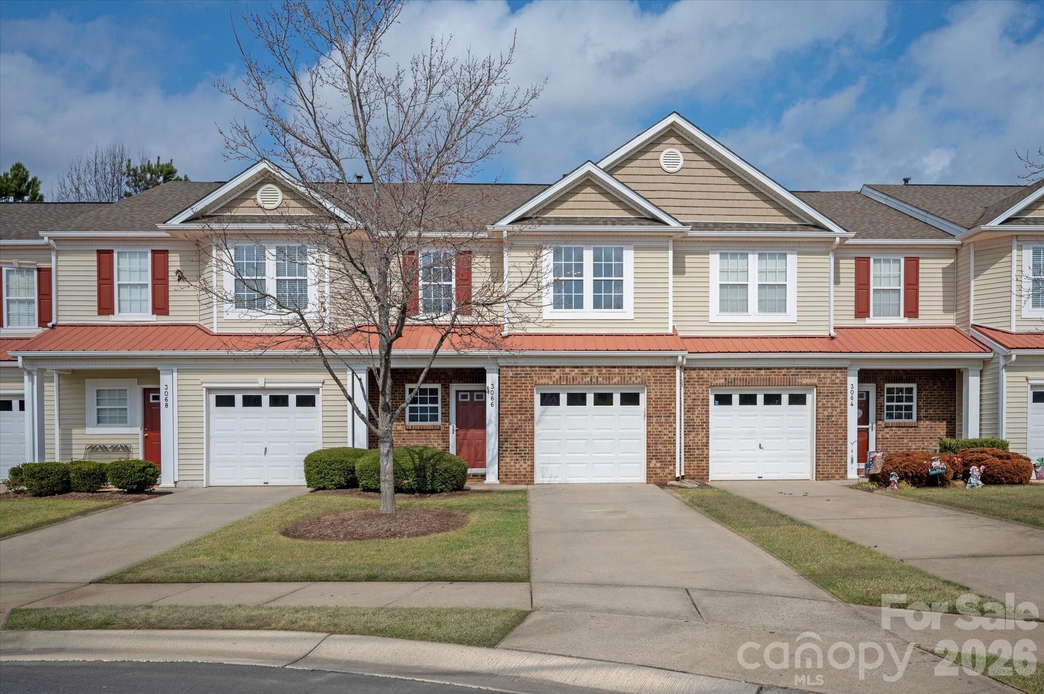 3066 Priory Ridge Drive, Unit 337 Fort Mill, SC 29707 - Photo 2 of 31 a front view of a house with a yard