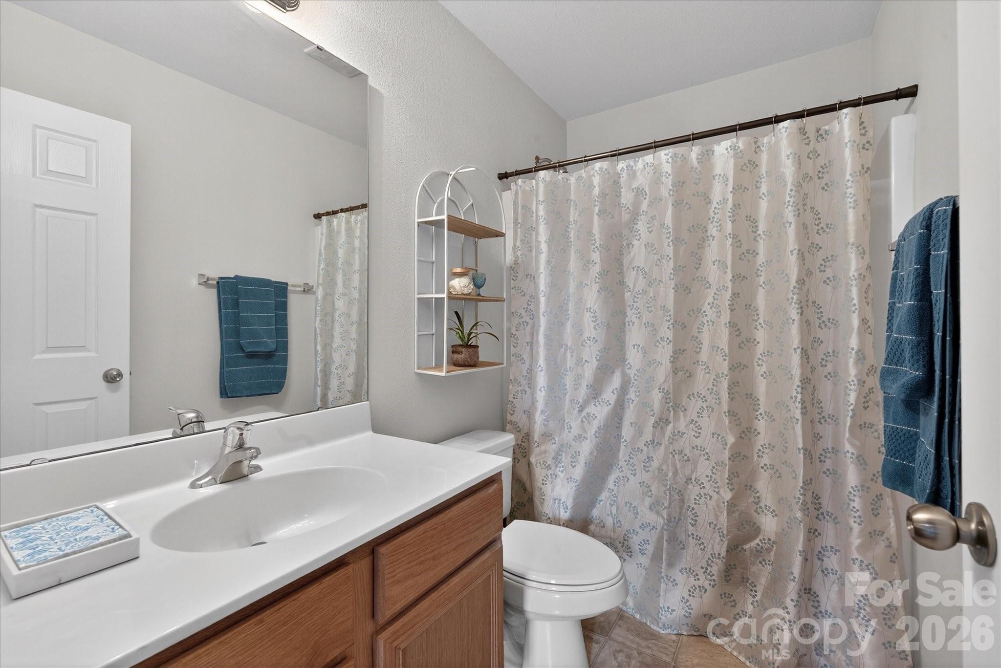 3066 Priory Ridge Drive, Unit 337 Fort Mill, SC 29707 - Photo 22 of 31 a bathroom with a sink toilet and shower