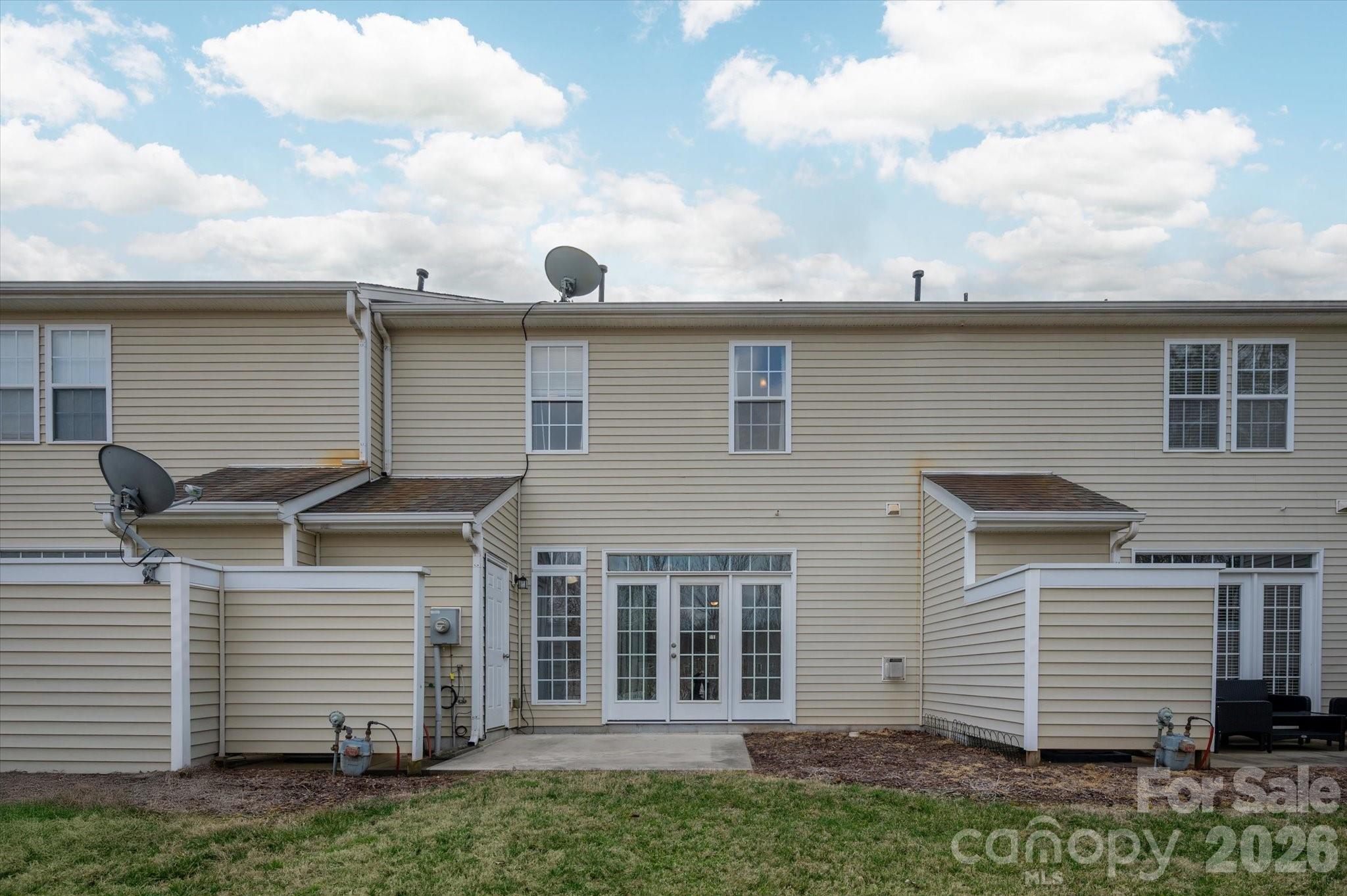 3066 Priory Ridge Drive, Unit 337 Fort Mill, SC 29707 - Photo 23 of 31 a view of a house with a backyard