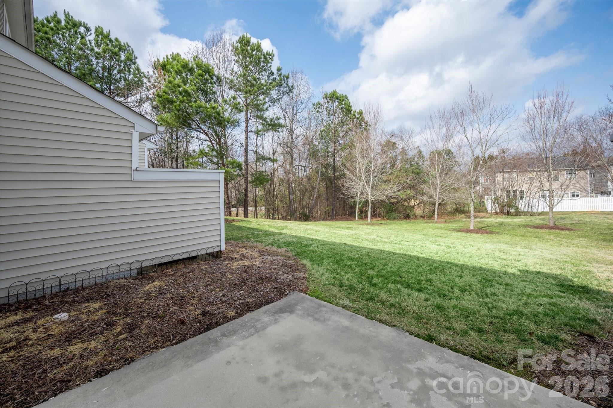 3066 Priory Ridge Drive, Unit 337 Fort Mill, SC 29707 - Photo 25 of 31 a view of a house with a yard