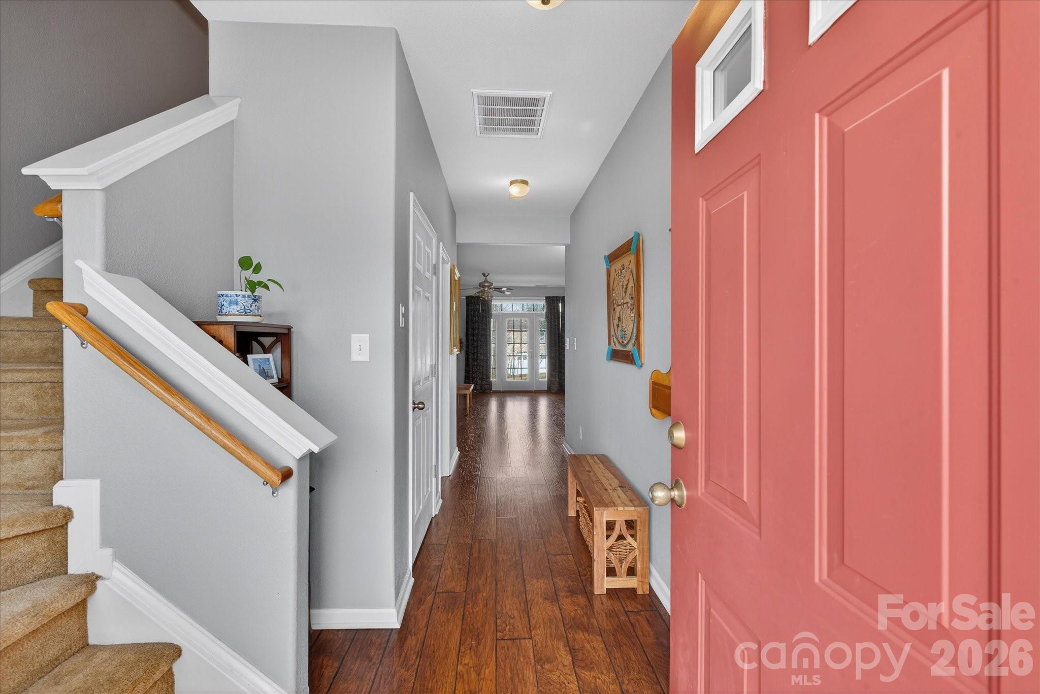 3066 Priory Ridge Drive, Unit 337 Fort Mill, SC 29707 - Photo 3 of 31 a hallway with wooden floor staircase and hallway