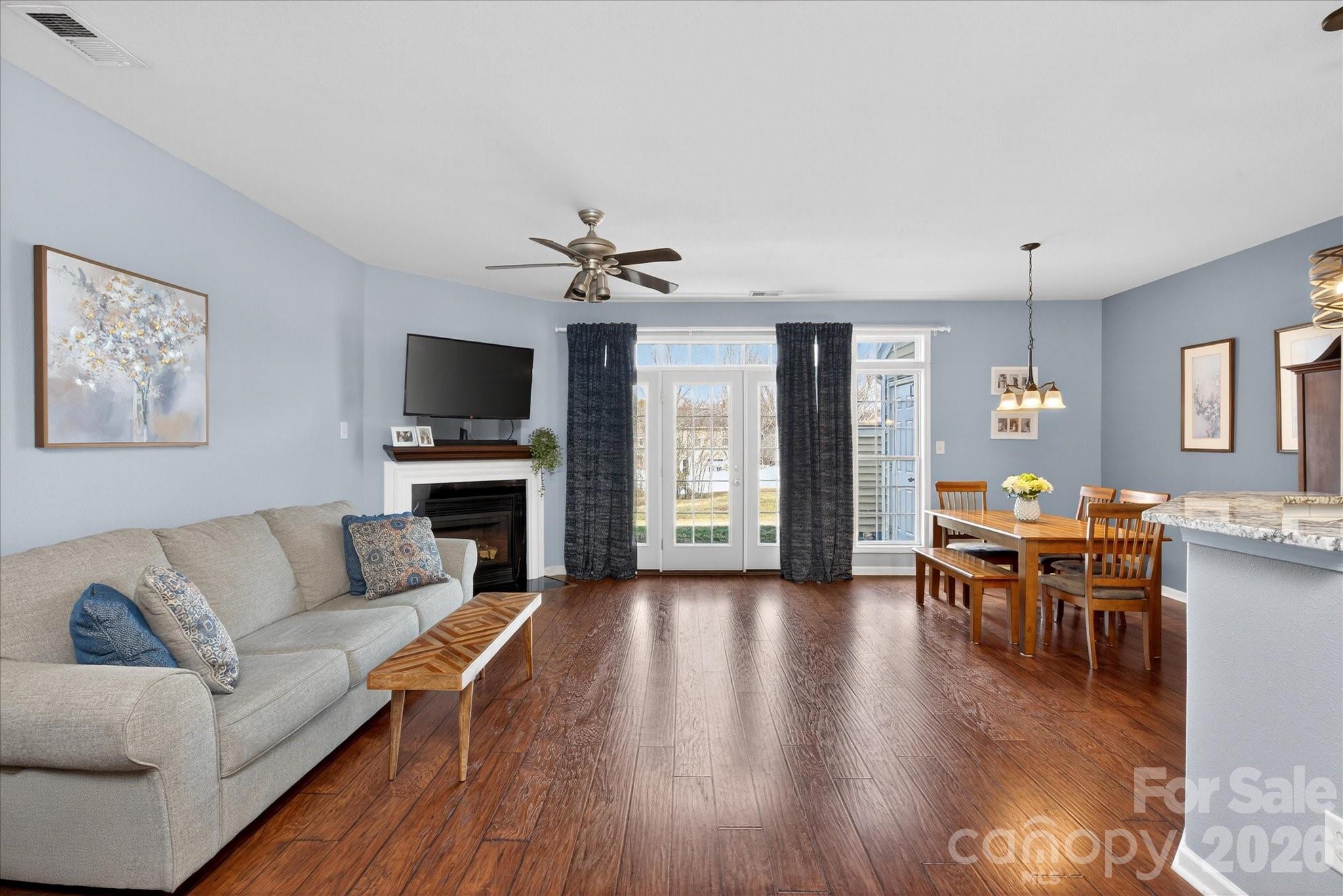 3066 Priory Ridge Drive, Unit 337 Fort Mill, SC 29707 - Photo 4 of 31 a living room with furniture and a flat screen tv