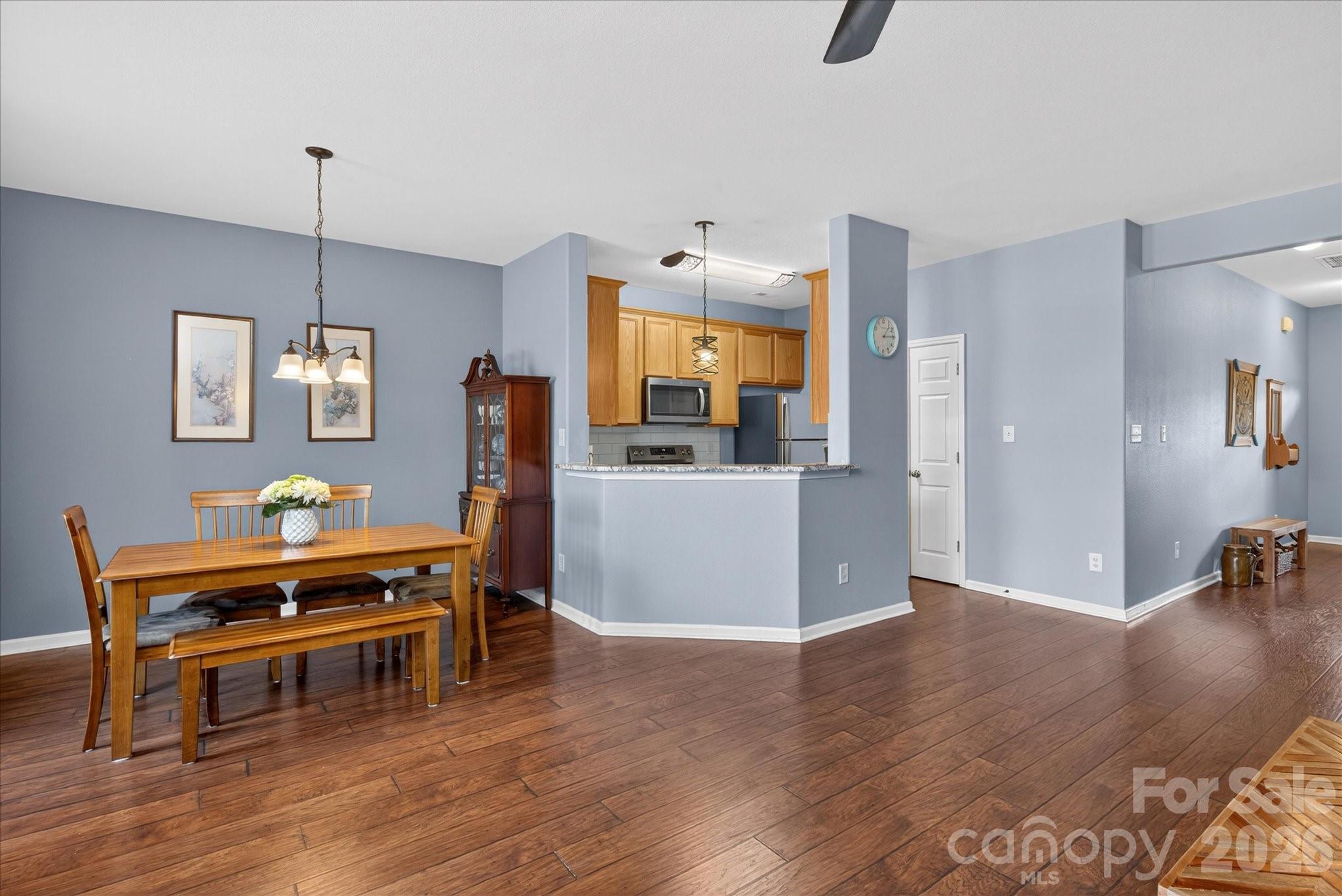 3066 Priory Ridge Drive, Unit 337 Fort Mill, SC 29707 - Photo 6 of 31 a living room with furniture and a wooden floor