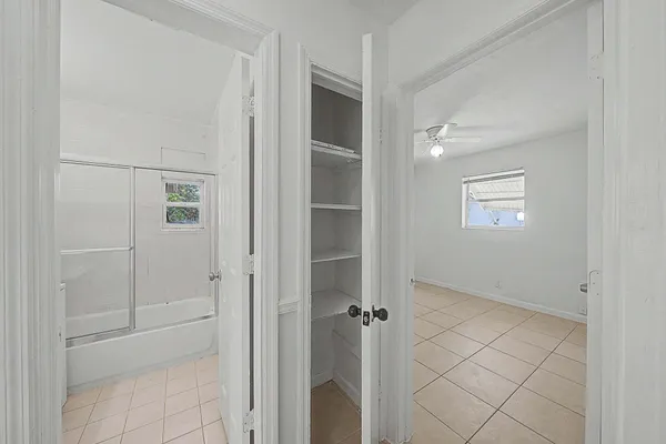 a view of an empty room with a window