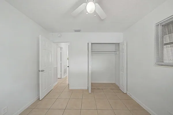a bathroom with a toilet sink and shower