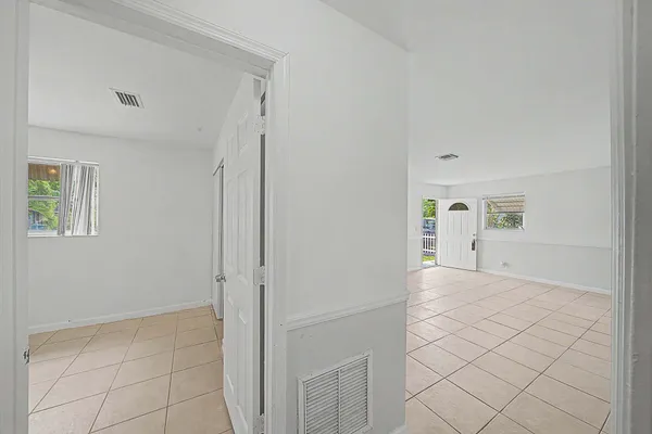 a view of an empty room and window