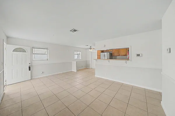a kitchen with stainless steel appliances a refrigerator and a stove
