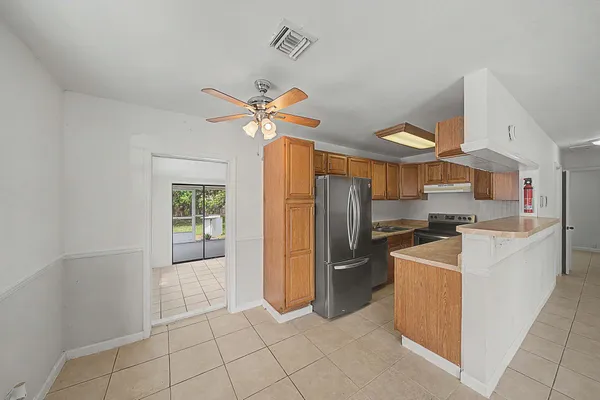 a kitchen with stainless steel appliances granite countertop a sink and cabinets