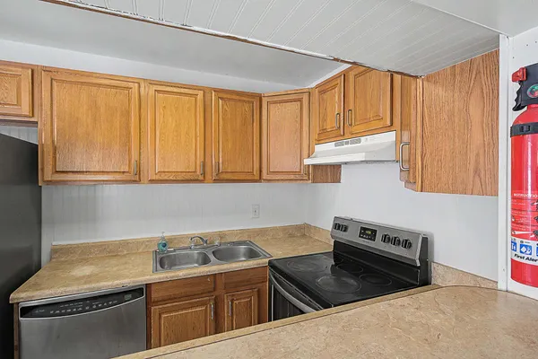 a view of a livingroom with a refrigerator
