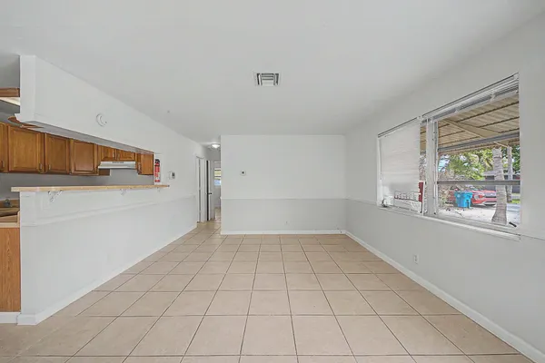a view of an empty room with a window