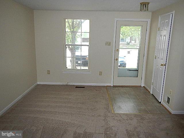 2219 Riding Crop Way Baltimore, MD 21244 - Photo 7 of 13 an empty room with windows