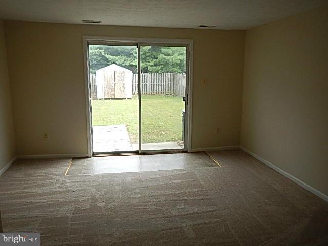 2219 Riding Crop Way Baltimore, MD 21244 - Photo 9 of 13 a view of an empty room with a window