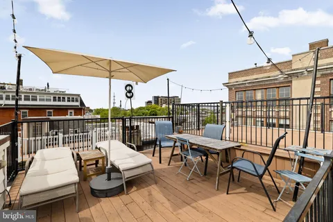 a view of a balcony with furniture