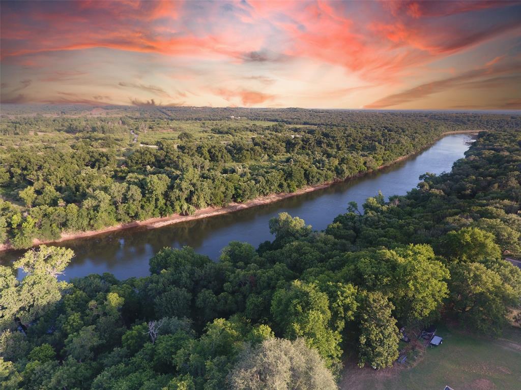 9710 Bellechase Road Granbury, TX 76049 - Photo 9 of 40 an aerial view of residential houses with outdoor space and trees