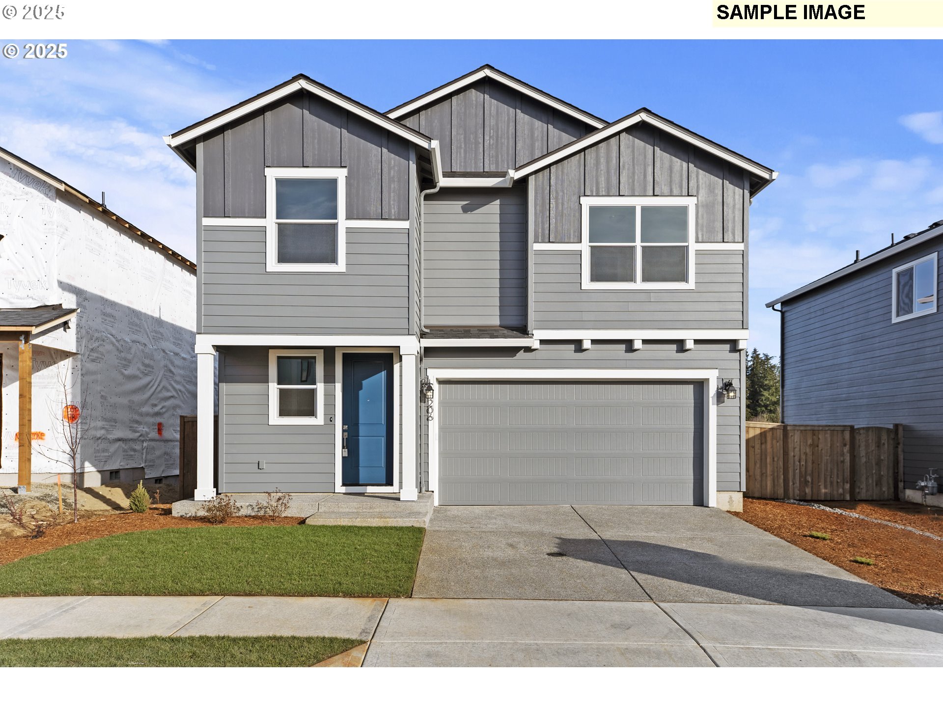 8807 South 1st Street, Unit 64 Ridgefield, WA 98642 - Photo 1 of 33 a front view of a house with a yard and garage