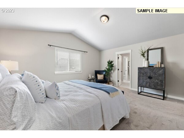8807 South 1st Street, Unit 64 Ridgefield, WA 98642 - Photo 12 of 33 a bedroom with a bed and a large window