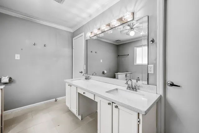 a bathroom with a sink a vanity and a mirror