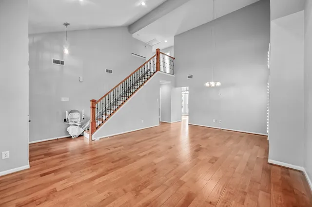 a view of an entryway with wooden floor