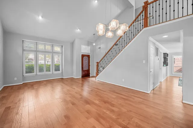 a view of an entryway with wooden floor