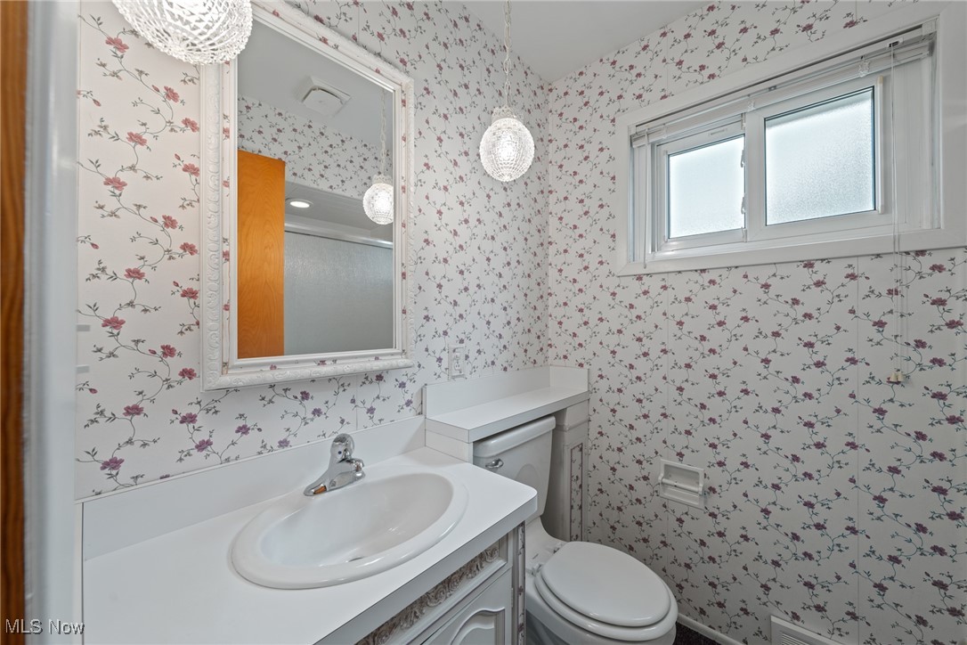 29776 Arthur Road Wickliffe, OH 44092 - Photo 22 of 49 Bathroom featuring wallpapered walls, vanity, and a shower