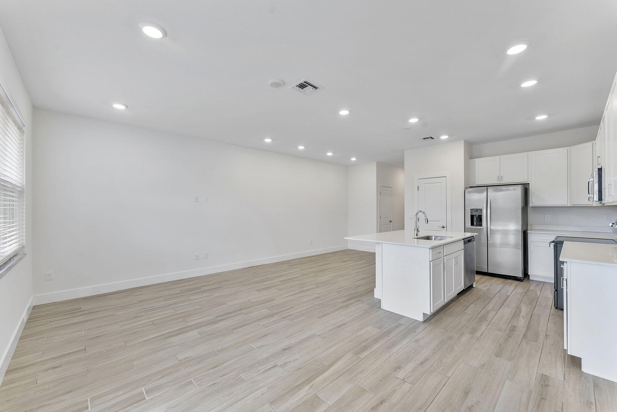 247 Preserve Trail North Stuart, FL 34994 - Photo 11 of 34 a view of kitchen with wooden floor and electronic appliances