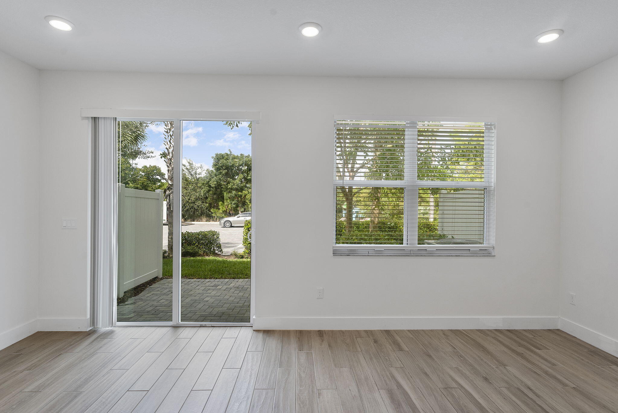 247 Preserve Trail North Stuart, FL 34994 - Photo 30 of 34 an empty room with wooden floor and windows