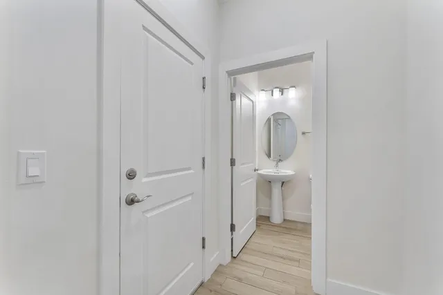 a view of a bathroom from a hallway