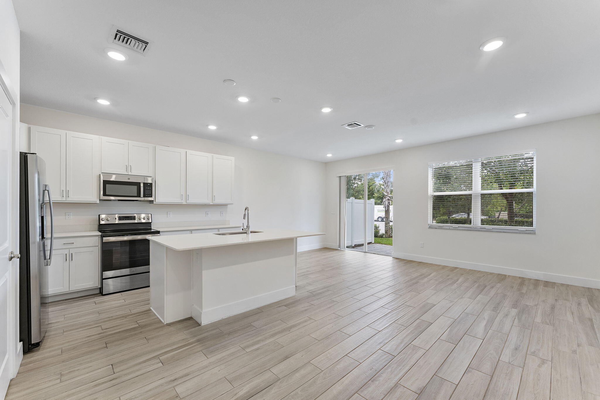247 Preserve Trail North Stuart, FL 34994 - Photo 5 of 34 a kitchen with stainless steel appliances a refrigerator sink and stove top oven