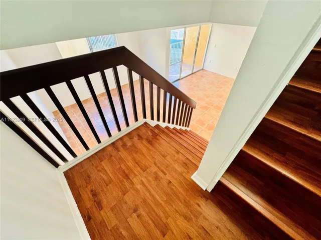 a balcony view with wooden floor