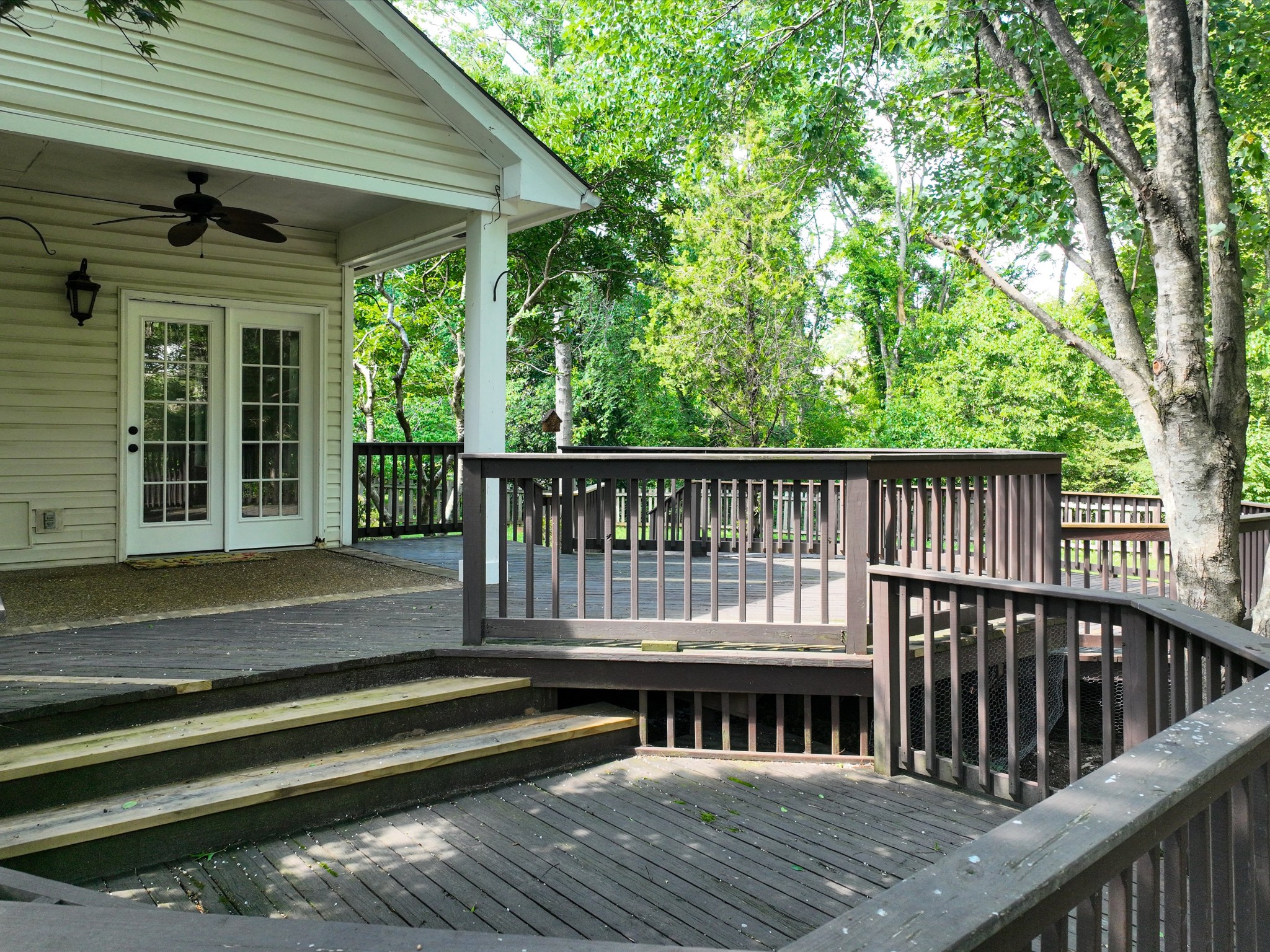 4629 Sandy Creek Road Nashville, TN 37221 - Photo 33 of 48 a view of a wooden deck and a yard