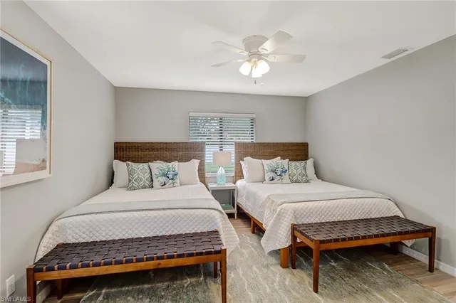 a bathroom with a granite countertop sink a mirror a shower and a bathtub