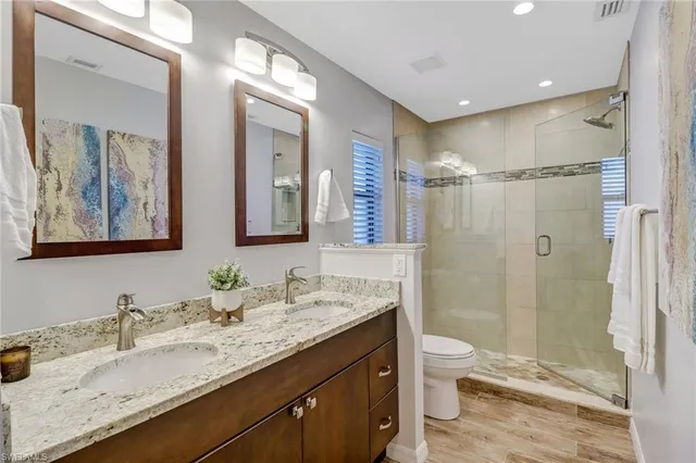 a bedroom with a large bed and a couch