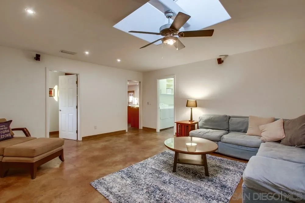 13401 Stone Canyon Road Poway, CA 92064 - Photo 17 of 25 a living room with furniture and a rug