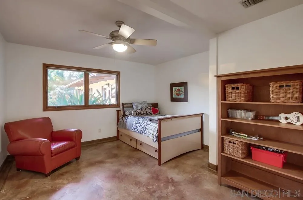 13401 Stone Canyon Road Poway, CA 92064 - Photo 19 of 25 a bed room with furniture and a window