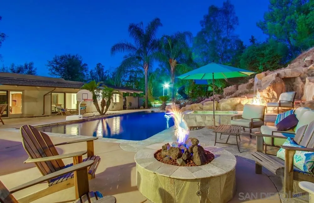 13401 Stone Canyon Road Poway, CA 92064 - Photo 6 of 25 a living room with furniture and a potted plant