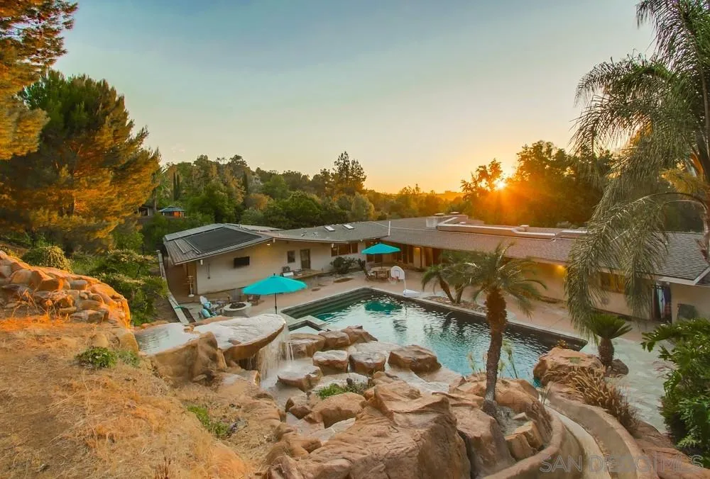 13401 Stone Canyon Road Poway, CA 92064 - Photo 8 of 25 a backyard of a house with table and chairs