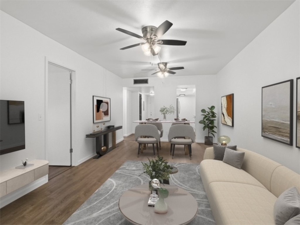 1166 6th Avenue, Unit C5 Vero Beach, FL 32960 - Photo 2 of 34 a living room with furniture kitchen view and a flat screen tv