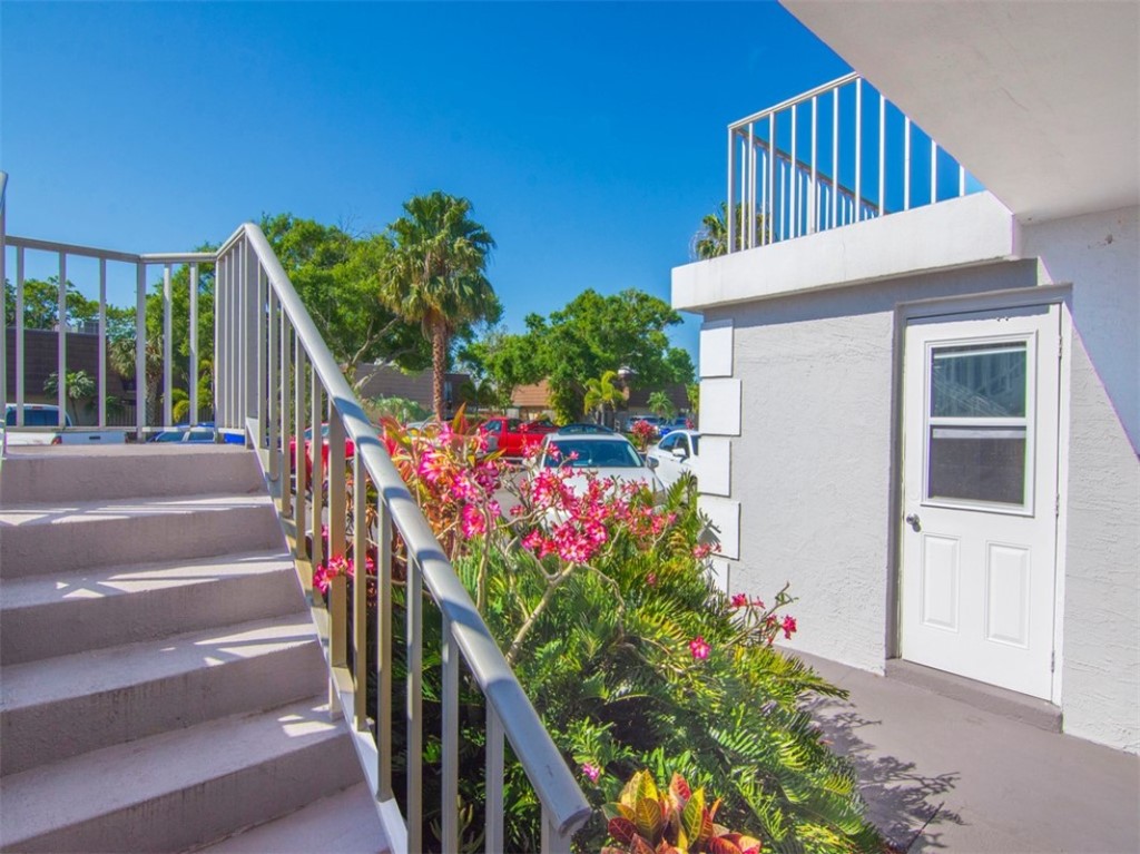 1166 6th Avenue, Unit C5 Vero Beach, FL 32960 - Photo 25 of 34 a view of a potted flower in the corridor
