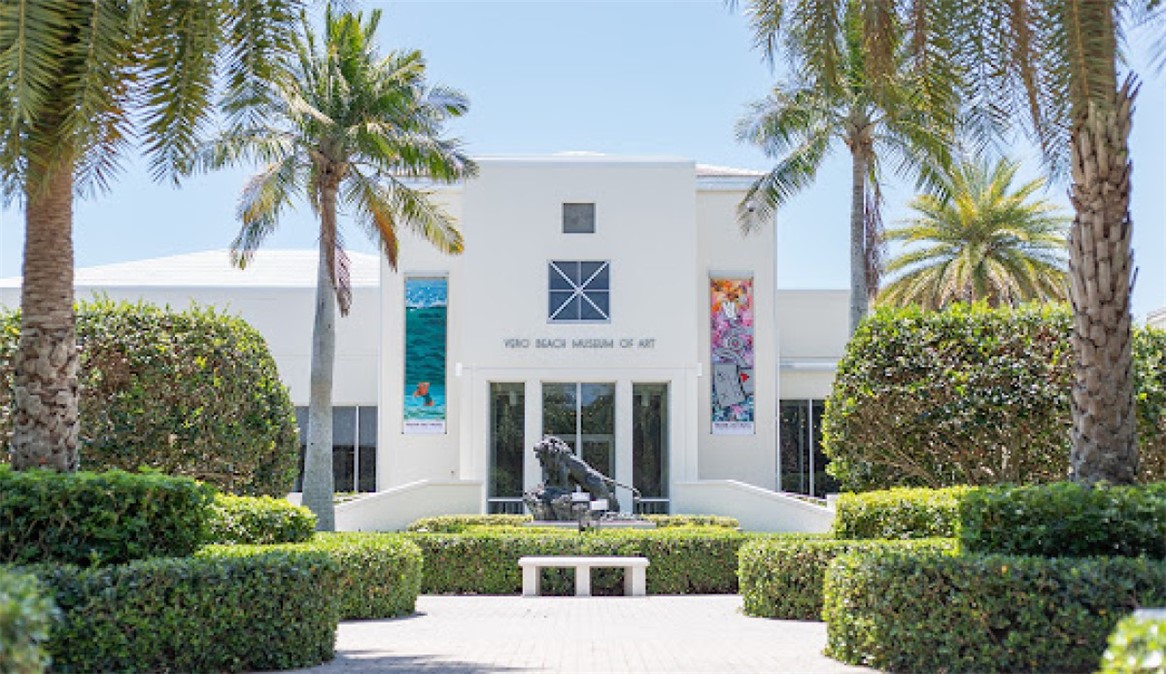 1166 6th Avenue, Unit C5 Vero Beach, FL 32960 - Photo 29 of 34 a front view of a house with a garden