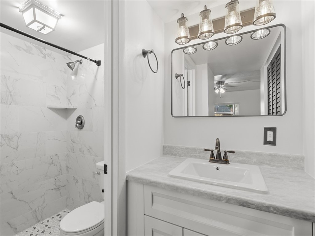 1166 6th Avenue, Unit C5 Vero Beach, FL 32960 - Photo 10 of 34 a bathroom with a sink a toilet and shower