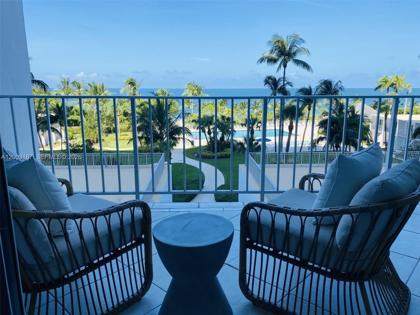881 Ocean Drive, Unit 3E Key Biscayne, FL 33149 - Photo 1 of 15 a view of a balcony with furniture