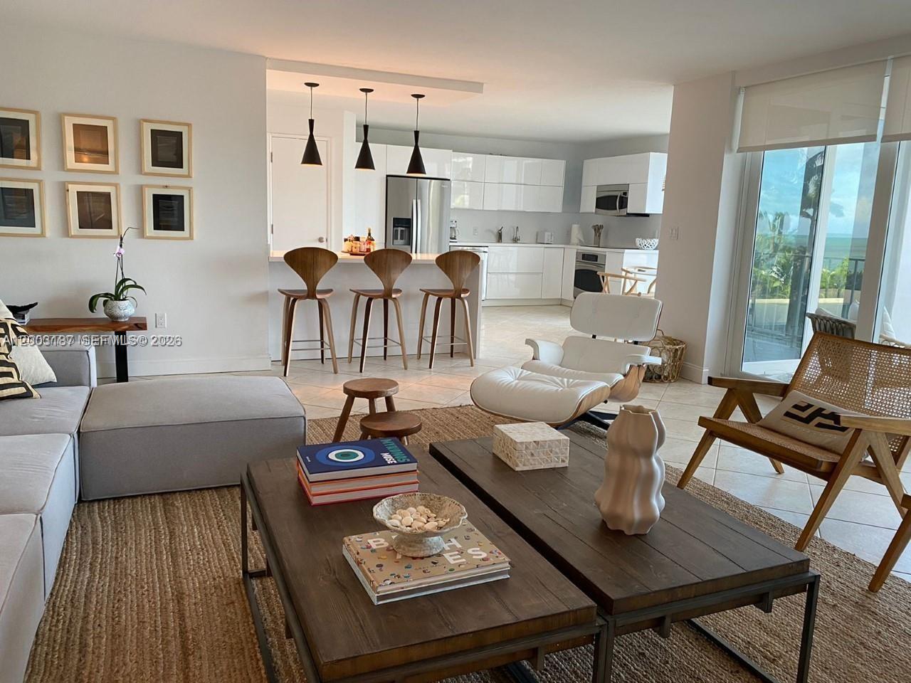 881 Ocean Drive, Unit 3E Key Biscayne, FL 33149 - Photo 5 of 15 a living room with furniture fireplace and wooden floor