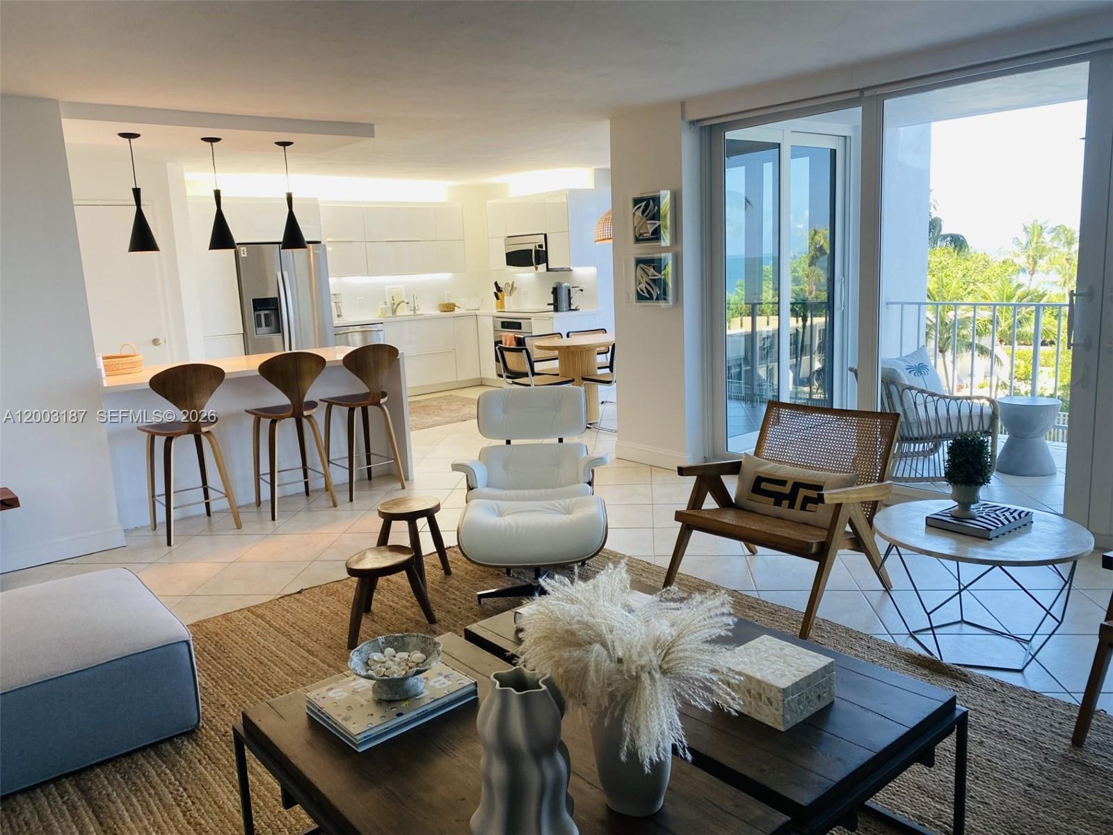 881 Ocean Drive, Unit 3E Key Biscayne, FL 33149 - Photo 7 of 15 a living room with furniture and a large window