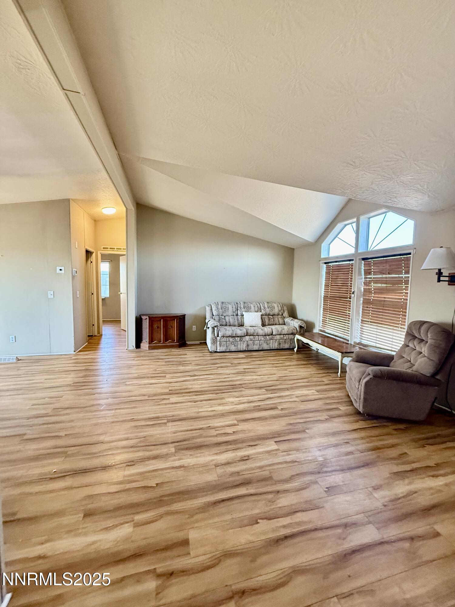 195 Classic Way Fallon, NV 89406 - Photo 3 of 10 a room with wooden floor and furniture