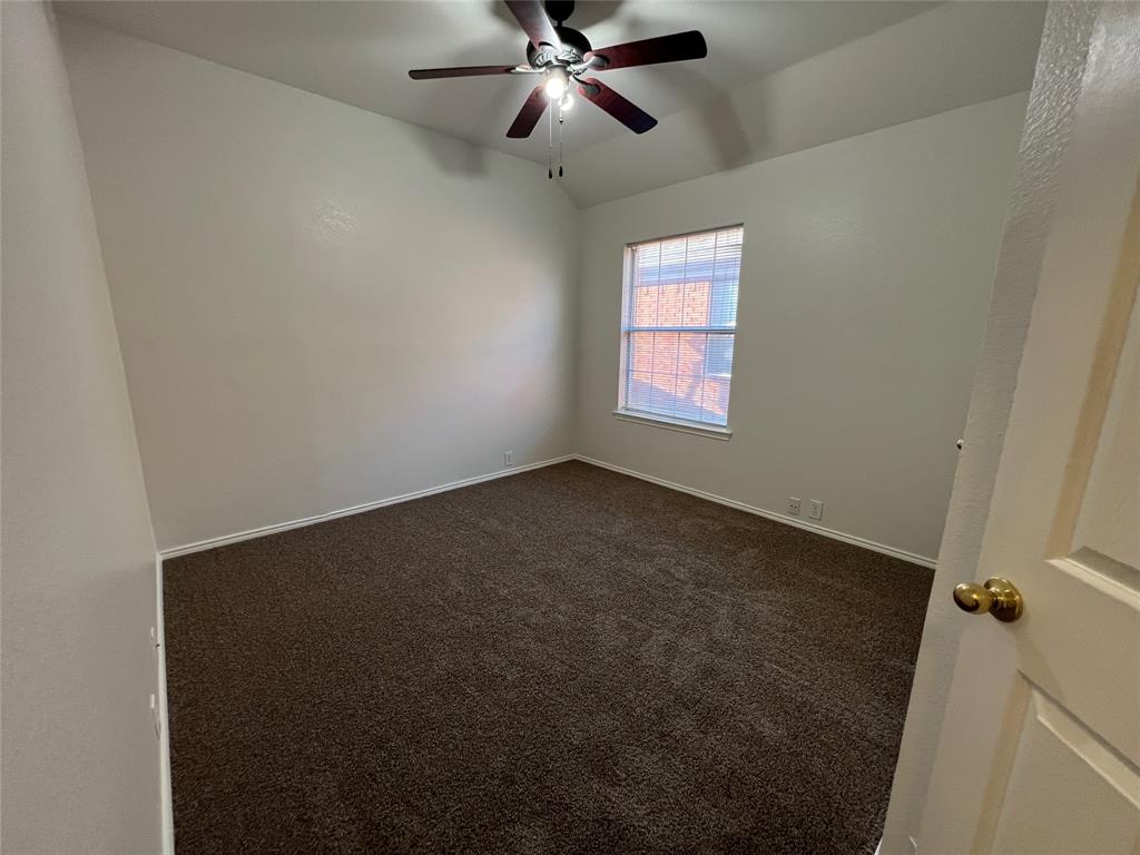 334 Touchdown Drive Irving, TX 75063 - Photo 20 of 32 Room featuring plush brown carpeting, a single window with blinds, and white baseboards