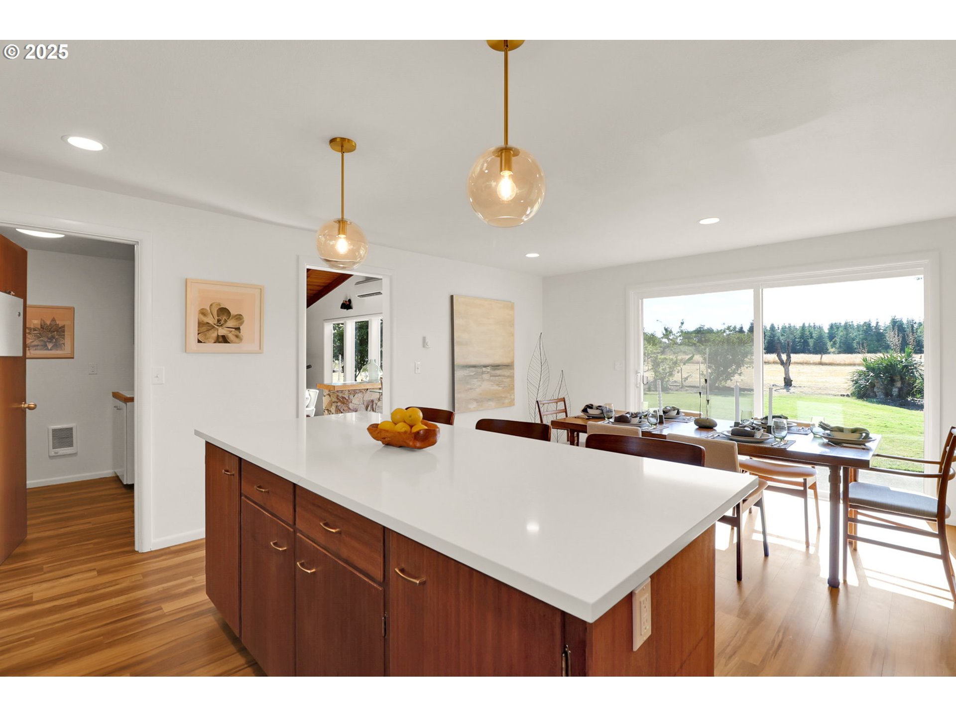 90774 Alvadore Road Junction City, OR 97448 - Photo 16 of 43 a kitchen with a table chairs and a view of living room