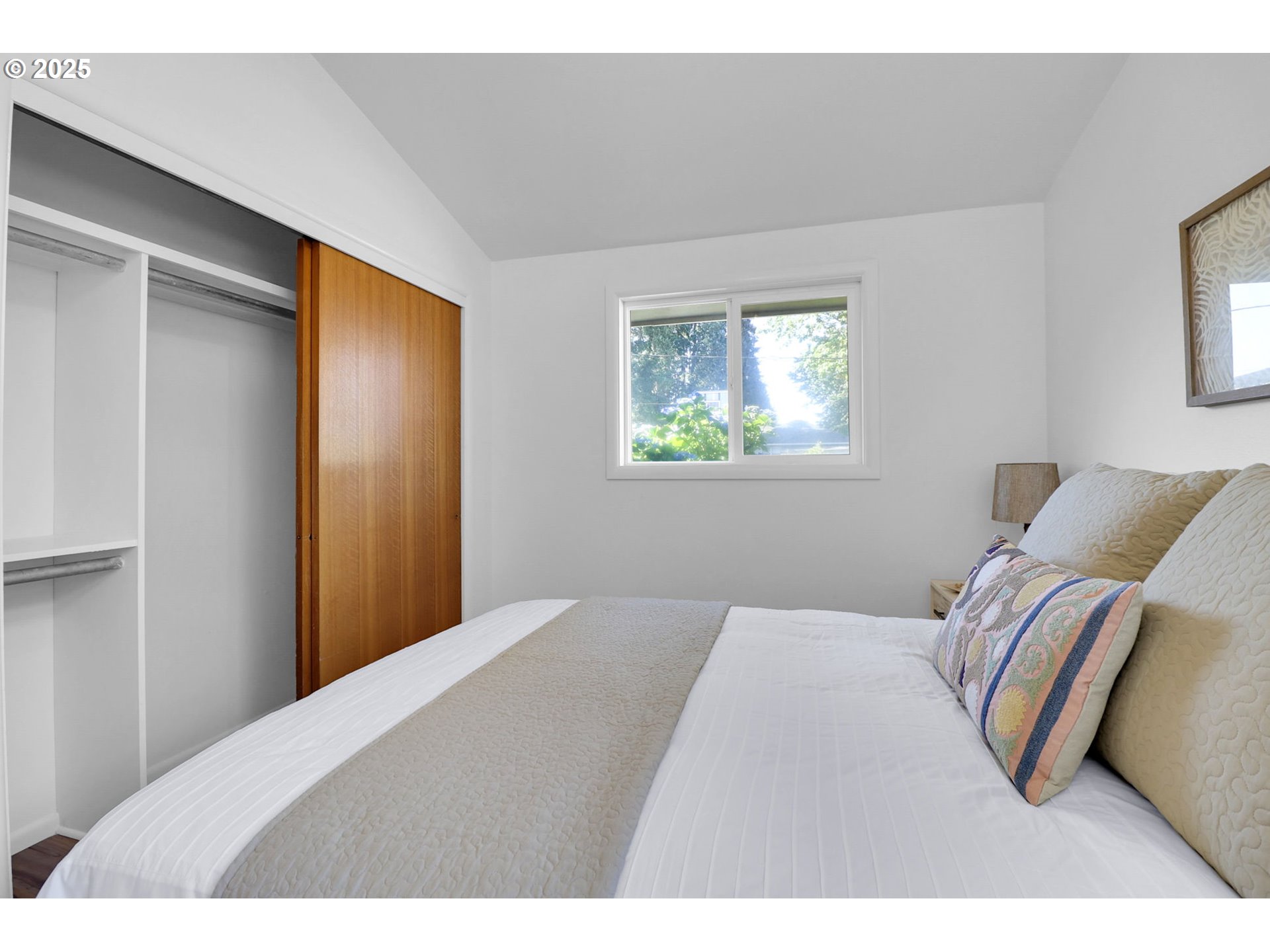 90774 Alvadore Road Junction City, OR 97448 - Photo 23 of 43 a bedroom with a bed and a painting on the wall